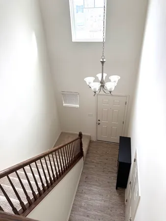 a bathroom with a sink a toilet a mirror and shower curtain