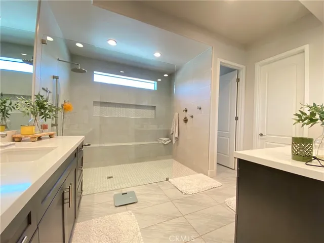 a large bathroom with a large tub and sink