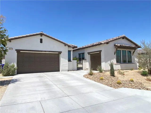 a front view of a house with yard