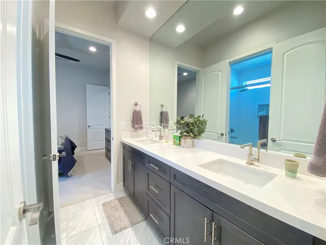 a bedroom with a bed and a television