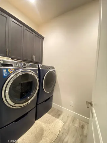 a bathroom with a sink and cabinets
