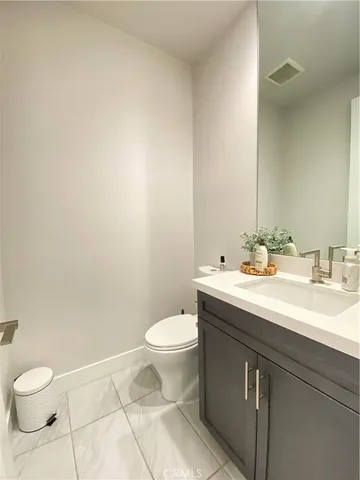 a view of a patio with dining table and chairs