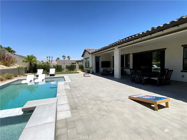 a view of swimming pool with a yard