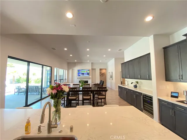 a large kitchen with lots of counter space cabinets and appliances