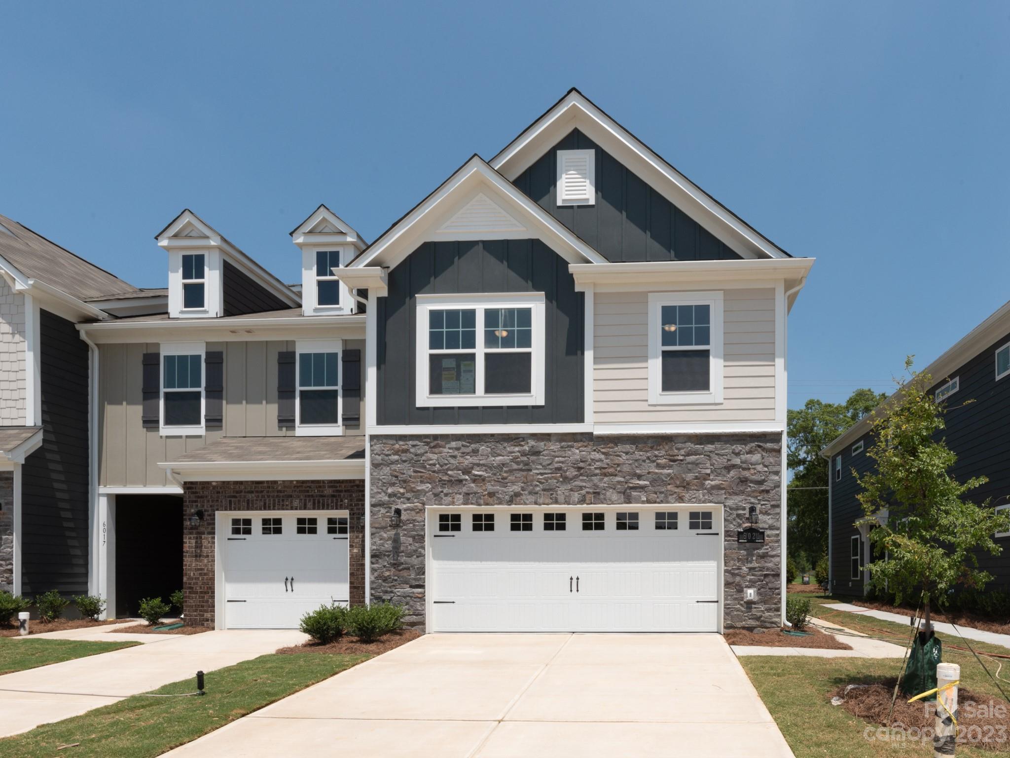 6021 Rizer Drive Charlotte, NC 28269 - Photo 2 of 2 a front view of a house with a yard