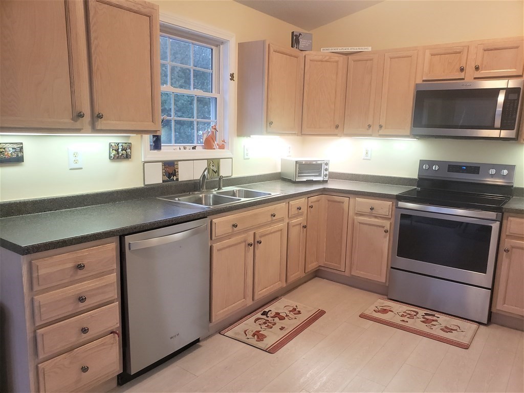 174 Old Belchertown Road Ware, MA 01082 - Photo 13 of 42 a kitchen with a sink stove and cabinets