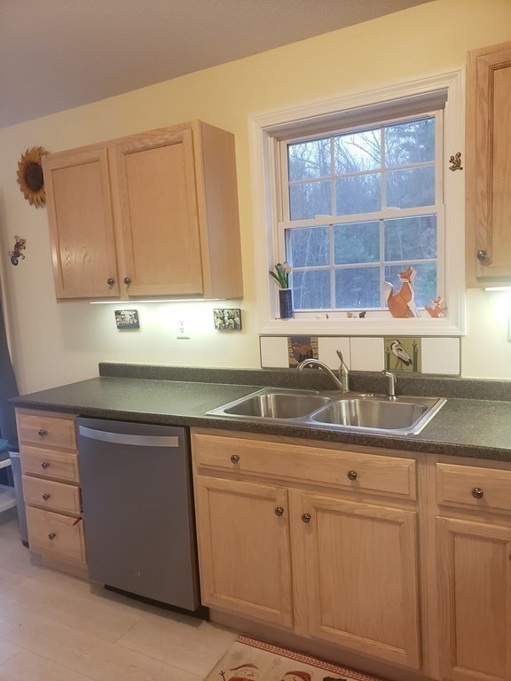 174 Old Belchertown Road Ware, MA 01082 - Photo 15 of 42 a kitchen with cabinets appliances a sink and a window