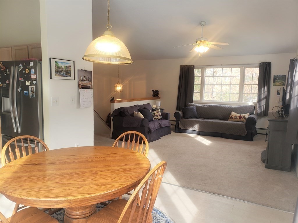 174 Old Belchertown Road Ware, MA 01082 - Photo 17 of 42 a dining room with furniture and a chandelier