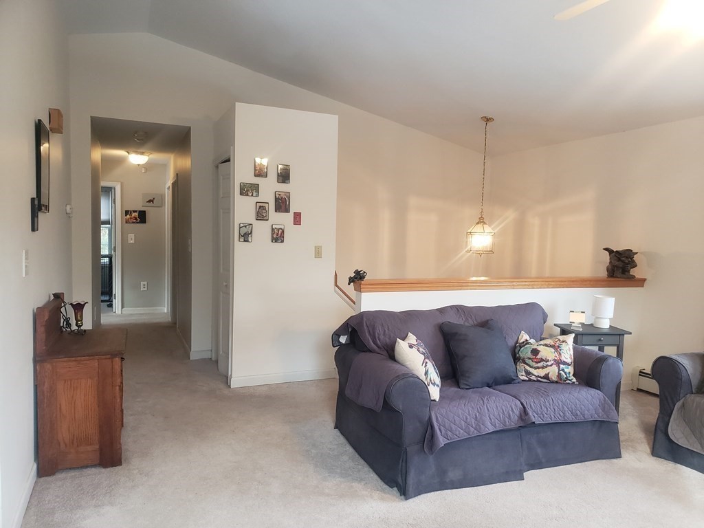 174 Old Belchertown Road Ware, MA 01082 - Photo 19 of 42 a living room with furniture and a chandelier