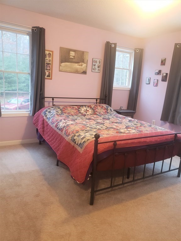 174 Old Belchertown Road Ware, MA 01082 - Photo 20 of 42 a bedroom with a bed table and a window