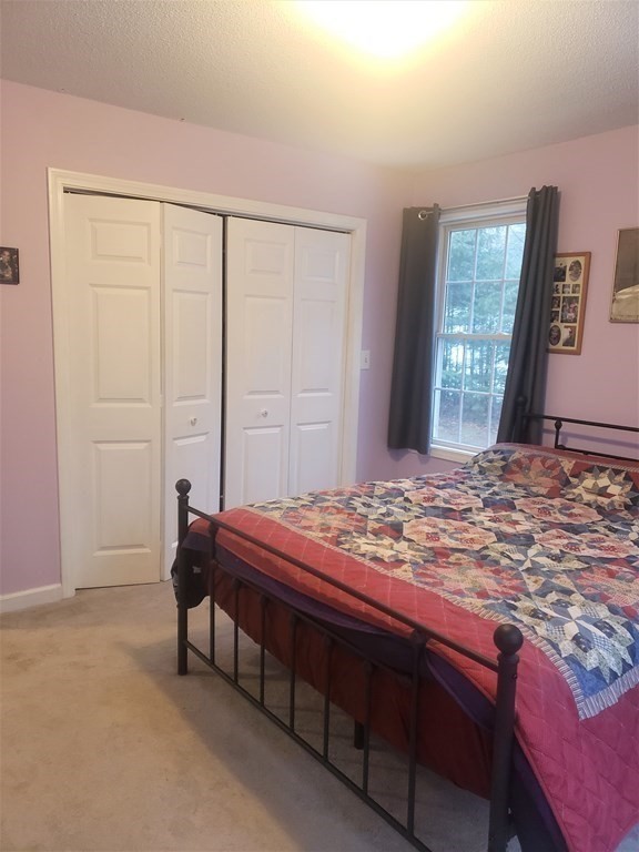 174 Old Belchertown Road Ware, MA 01082 - Photo 24 of 42 a bedroom with a bed and a window