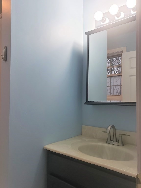 174 Old Belchertown Road Ware, MA 01082 - Photo 27 of 42 a bathroom with a sink vanity and a mirror