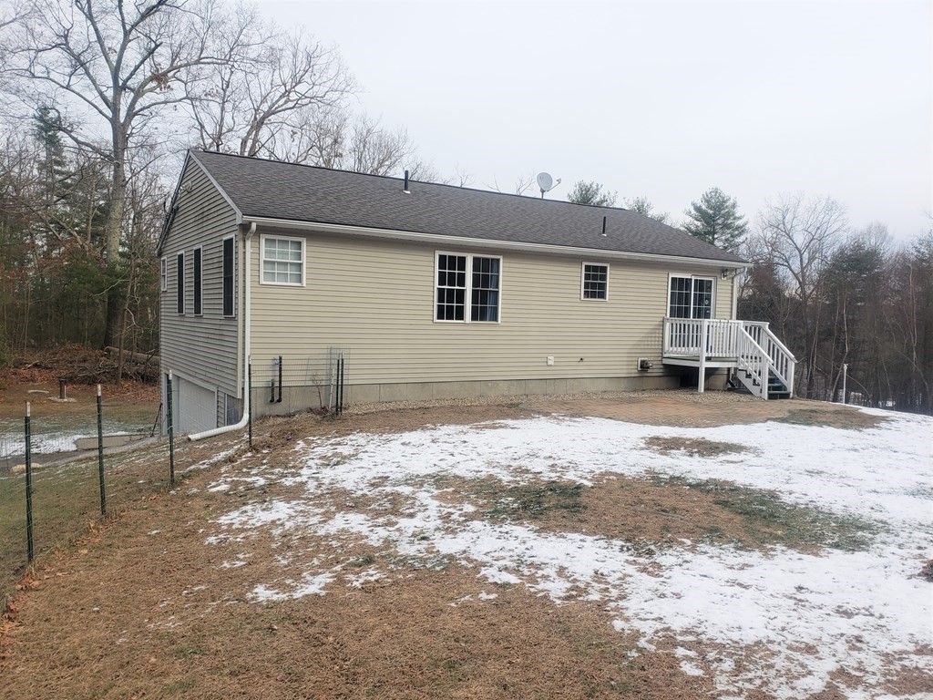 174 Old Belchertown Road Ware, MA 01082 - Photo 4 of 42 a view of a house with a yard covered in snow