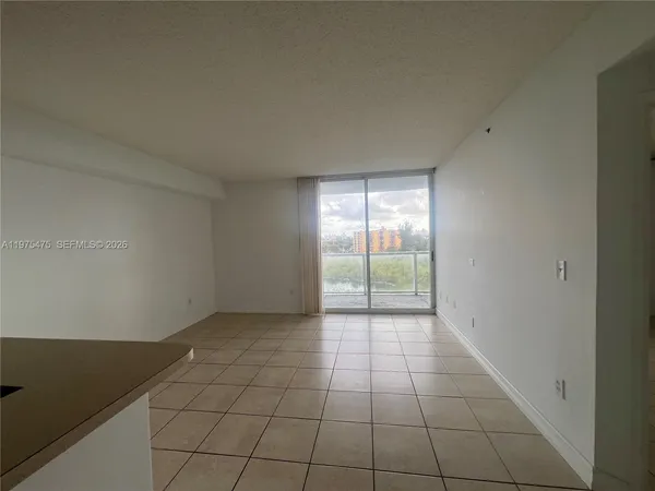 a view of an empty room and window