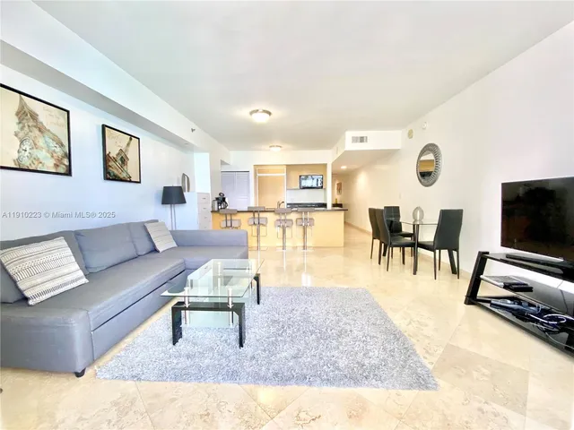 a view of a living room and dining room