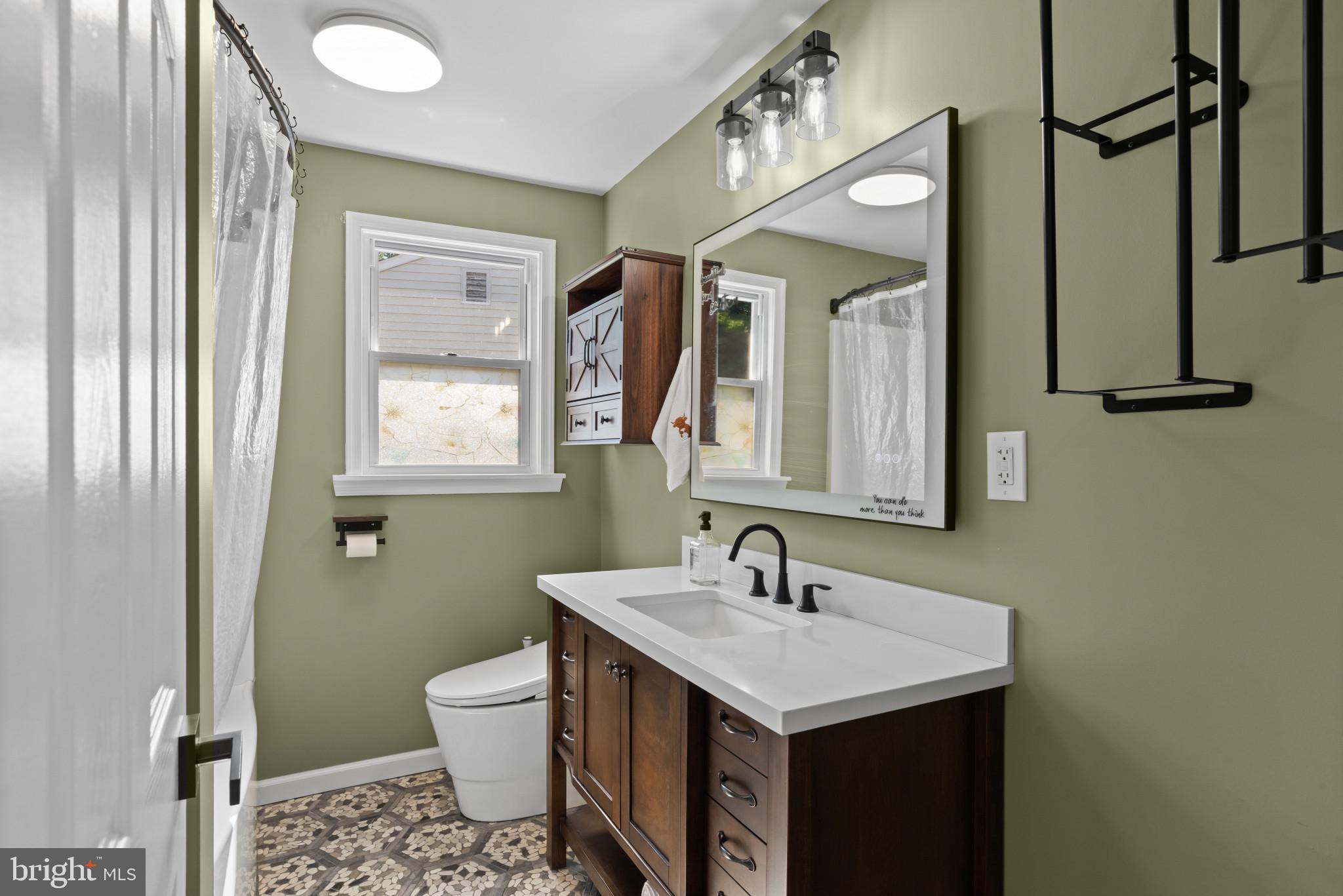14 Sharon Road Enola, PA 17025 - Photo 17 of 40 Bathroom featuring a wood-finish vanity with a whi