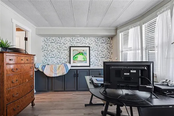 a kitchen with a wooden table and chairs
