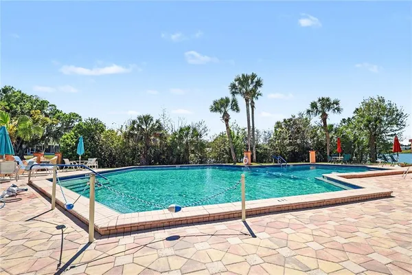 a view of a park with trees and grass