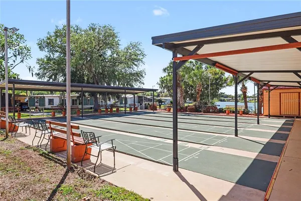 a view of a two chairs in the balcony