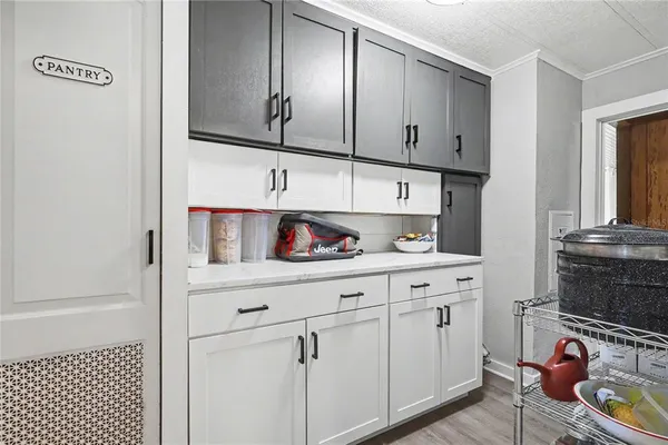 a kitchen with cabinets and window