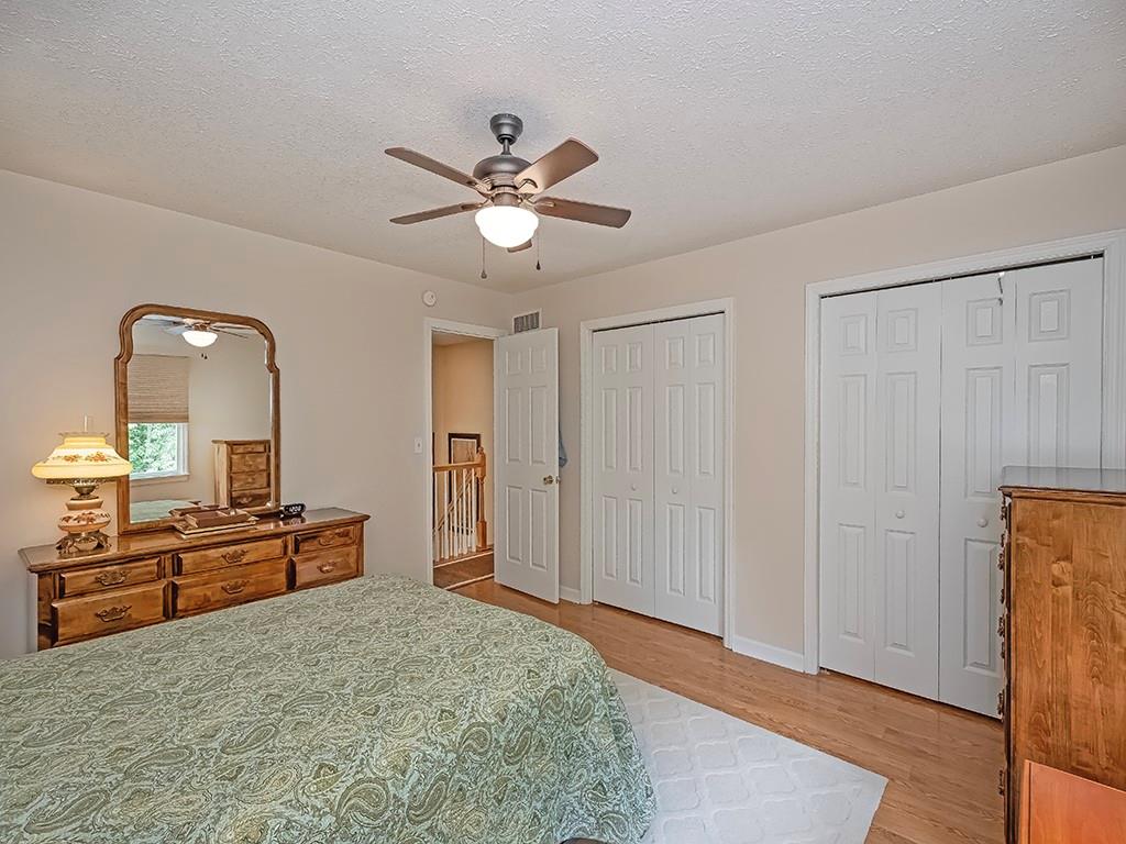 406 Country View Drive Lower Burrell, PA 15068 - Photo 19 of 31 a bedroom with a bed and a chandelier