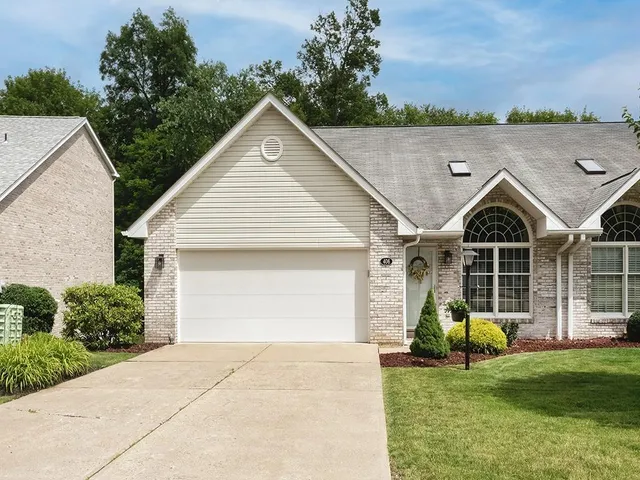 a view of a house with backyard