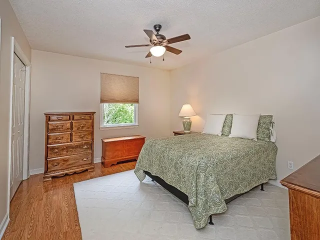 a bedroom with a bed and a dresser