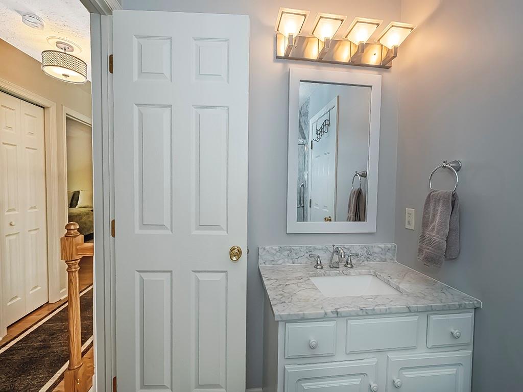 406 Country View Drive Lower Burrell, PA 15068 - Photo 28 of 31 a bathroom with a granite countertop sink and a mirror