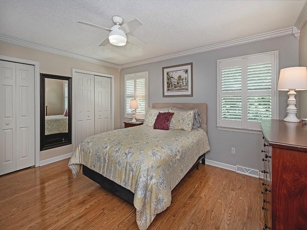 406 Country View Drive Lower Burrell, PA 15068 - Photo 29 of 31 a bedroom with a large bed chandelier and a window