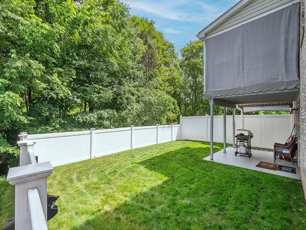 406 Country View Drive Lower Burrell, PA 15068 - Photo 31 of 31 a view of backyard with a table and chairs