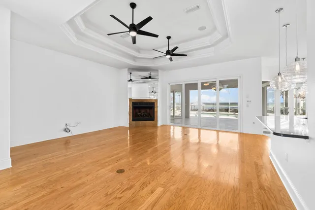 a kitchen with a checkered floor and white cabinets