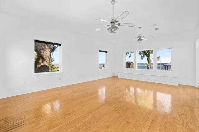 a spacious bathroom with a tub sink and mirror