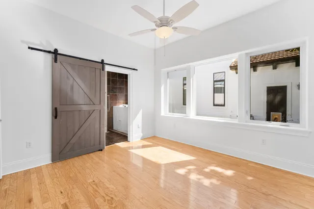 a view of a room with stairs and white walls