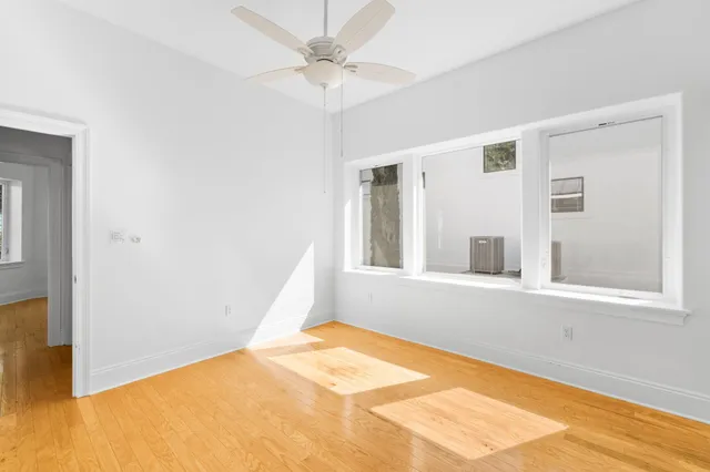 a view of a swimming pool with a patio and a yard