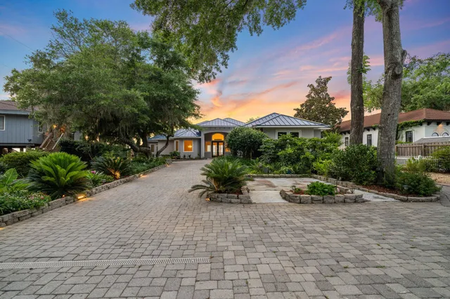 a view of empty room with wooden floor and fireplace