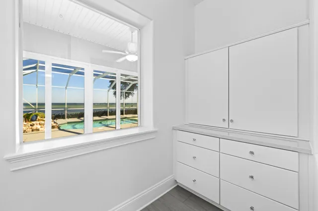 a view of swimming pool with a patio and plants