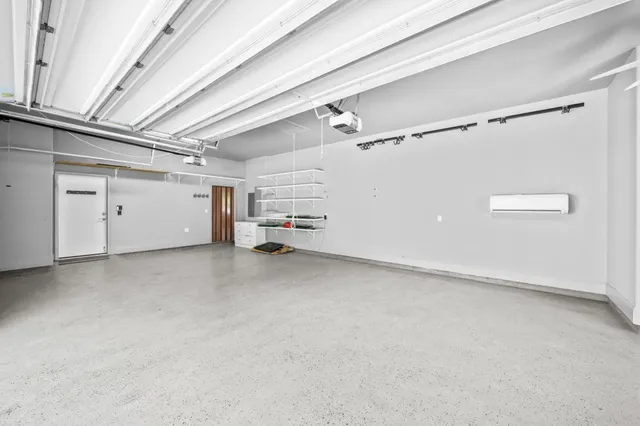 an aerial view of a house with a yard swimming pool and outdoor seating