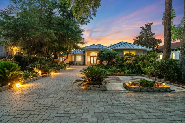 a view of empty room with window and wooden floor