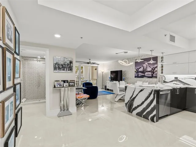 a bathroom with a double vanity sink mirror and bathtub
