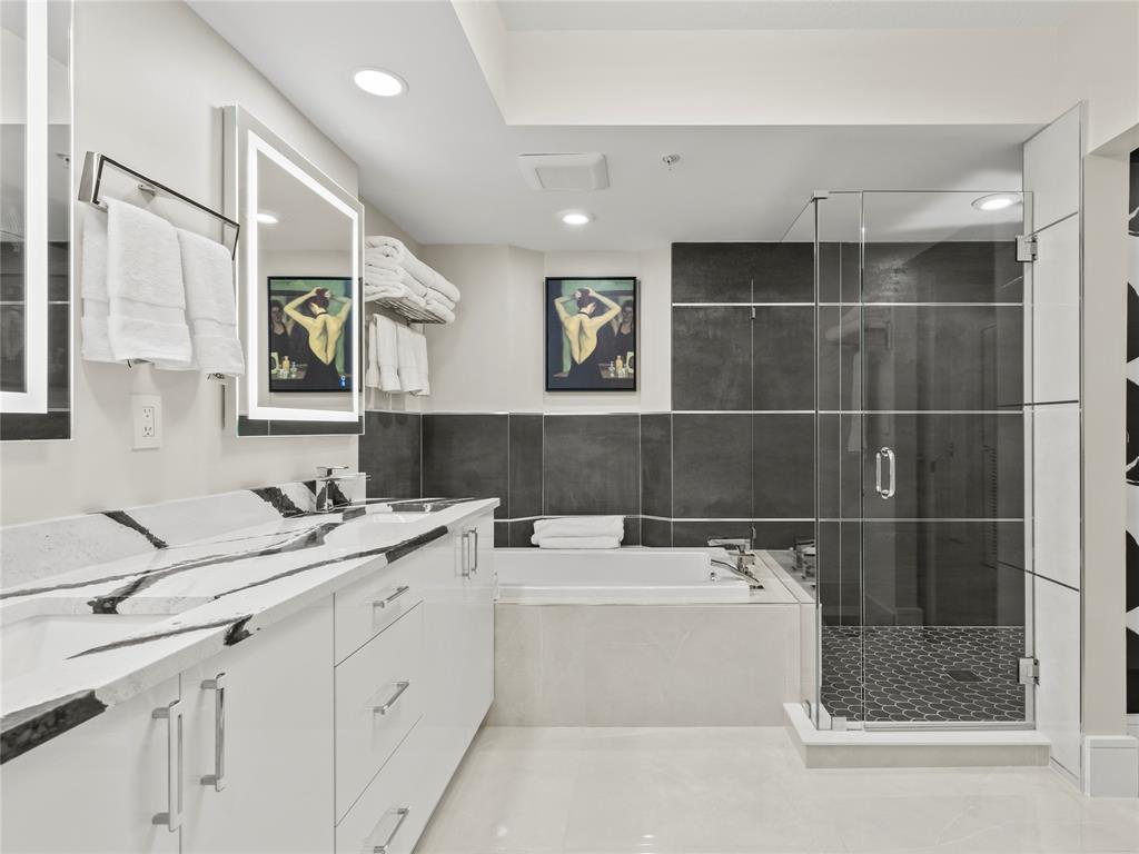 2700 North Federal Highway, Unit 407 Boynton Beach, FL 33435 - Photo 28 of 31 a bathroom with a double vanity sink mirror and bathtub