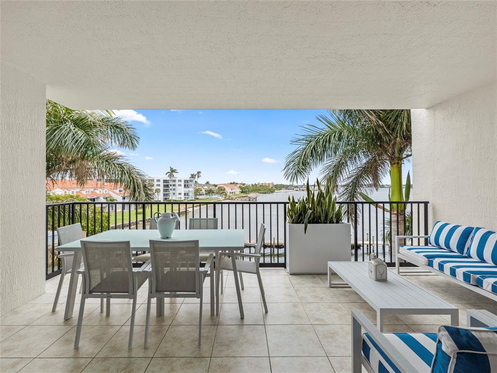 2700 North Federal Highway, Unit 407 Boynton Beach, FL 33435 - Photo 29 of 31 a view of a chairs and table in patio