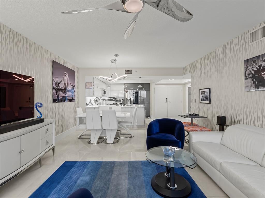 2700 North Federal Highway, Unit 407 Boynton Beach, FL 33435 - Photo 5 of 31 a living room with furniture and a flat screen tv