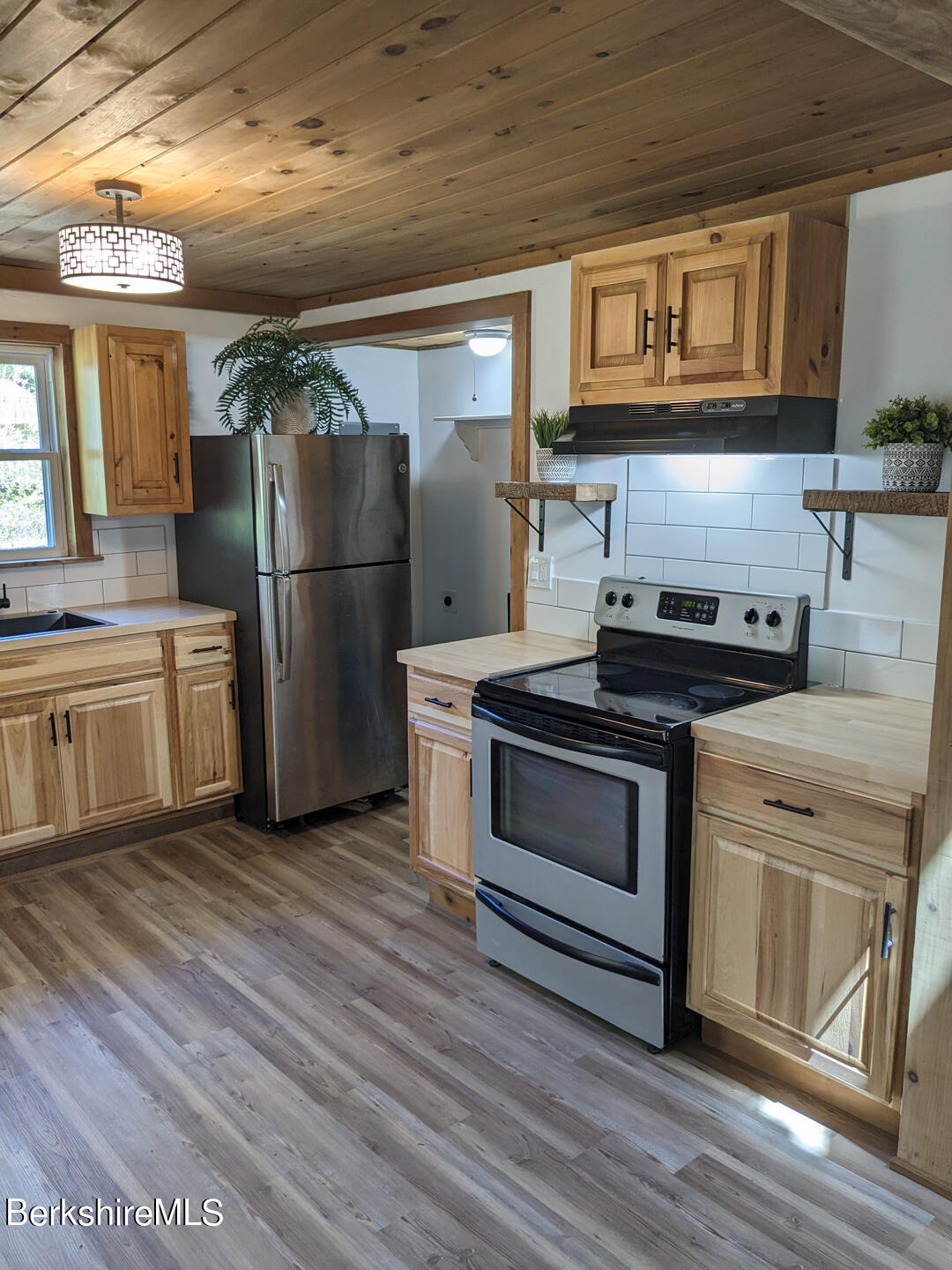 1430 Old Rte 9 Windsor, MA 01270 - Photo 12 of 24 a kitchen with stainless steel appliances granite countertop a stove and a refrigerator