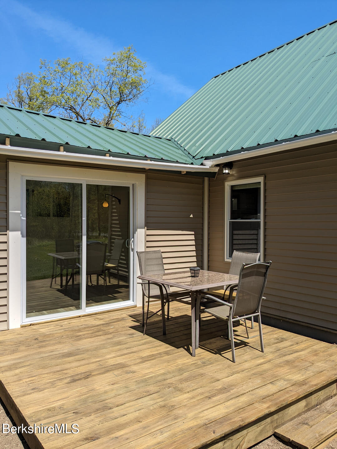 1430 Old Rte 9 Windsor, MA 01270 - Photo 19 of 24 a view of a patio with table and chairs with wooden floor and fence