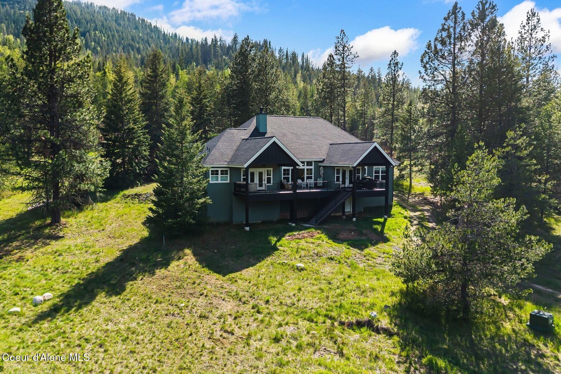 261 Hawkwind Trail Cocolalla, ID 83813 - Photo 2 of 104 Tranquil setting of back porch