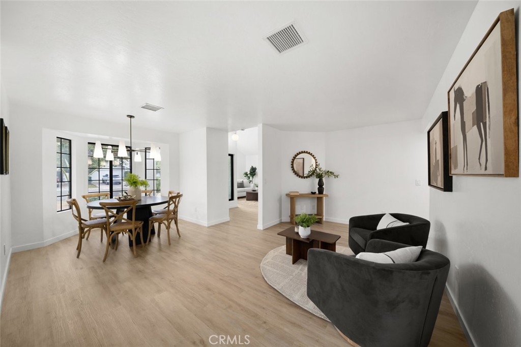 928 Austin Court Paso Robles, CA 93446 - Photo 16 of 30 a living room with furniture a dining table and a chandelier