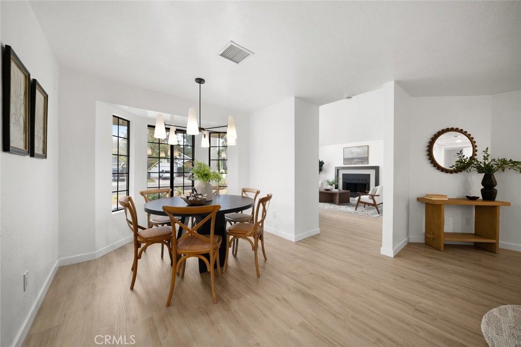 928 Austin Court Paso Robles, CA 93446 - Photo 17 of 30 a view of a dining room with furniture window and wooden floor