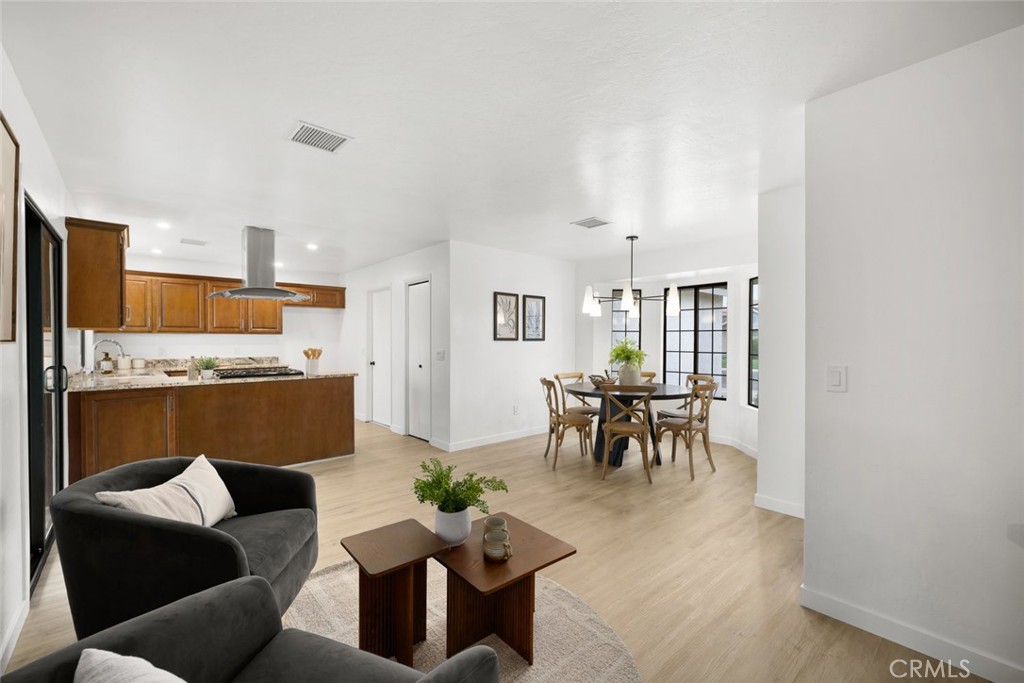 928 Austin Court Paso Robles, CA 93446 - Photo 20 of 30 a living room with furniture and a dining table with kitchen view