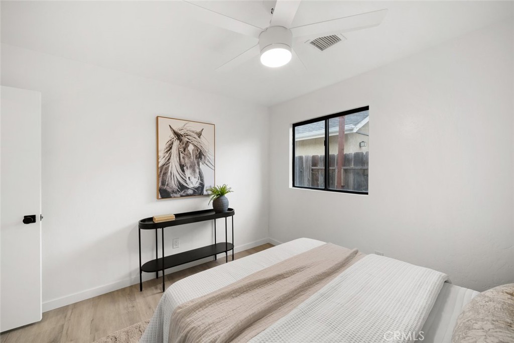 928 Austin Court Paso Robles, CA 93446 - Photo 27 of 30 a bedroom with a bed and a chandelier