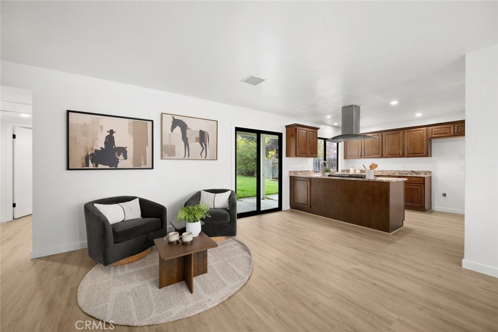 928 Austin Court Paso Robles, CA 93446 - Photo 6 of 30 a living room with kitchen island furniture and a wooden floor